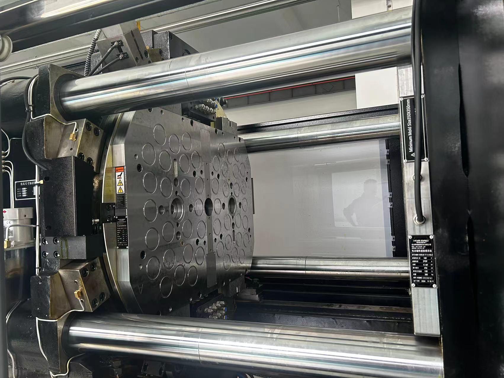 Magnetic platen for two color injection molding machine
